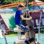 Bambini che giocano sull'attrezzatura da gioco Andromeda, steel structure