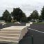 Attrezzature per skate park, comprese rampe e gradini, parte di Combination 19, in un contesto all'aperto.