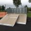 Quarter 2 - rampa da skateboard con superficie in legno in un parco.