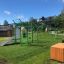 Attrezzatura fitness all'aperto New Age Fit MEDIUM in un'area verde del parco.
