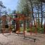 Struttura fitness all'aperto New Age Fit MEDIUM in un contesto di parco.