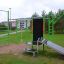 Attrezzatura fitness all'aperto New Age Fit MEDIUM in un contesto di parco.