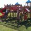 Space Station castle with slide in un parco giochi con bambini che giocano