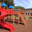 Space Station castle with slide in un'installazione di parco giochi