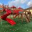 Space Station castle with slide, attrezzature da parco giochi all'aperto con scivoli rossi e struttura per arrampicarsi