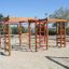 Activity Center wooden playhouse con strutture da arrampicata e scale nel parco giochi