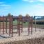 Activity Center wooden playhouse su un parco giochi sabbioso