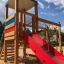 Logo Tower with Climbing Net playhouse with slide nel parco giochi