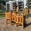 Smart Modern Nature wooden playhouse with slide davanti a edifici residenziali