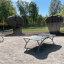 Outdoor Table Tennis Organic in un parco soleggiato con strutture da arrampicata sullo sfondo
