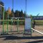 Attrezzatura fitness all'aperto Information Board NAF con istruzioni di allenamento in un parco.