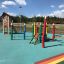 Lisa's Playhouse with slide in un parco giochi colorato
