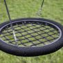 Altalena rotonda Single Swing (BNS 90cm) con rete intrecciata e corda nera per parco giochi.